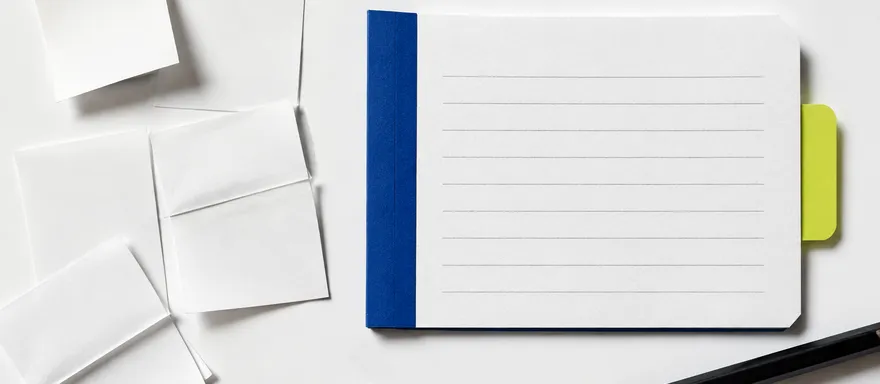 Loose paper notes organized into a structured brief with cobalt and lime tabs